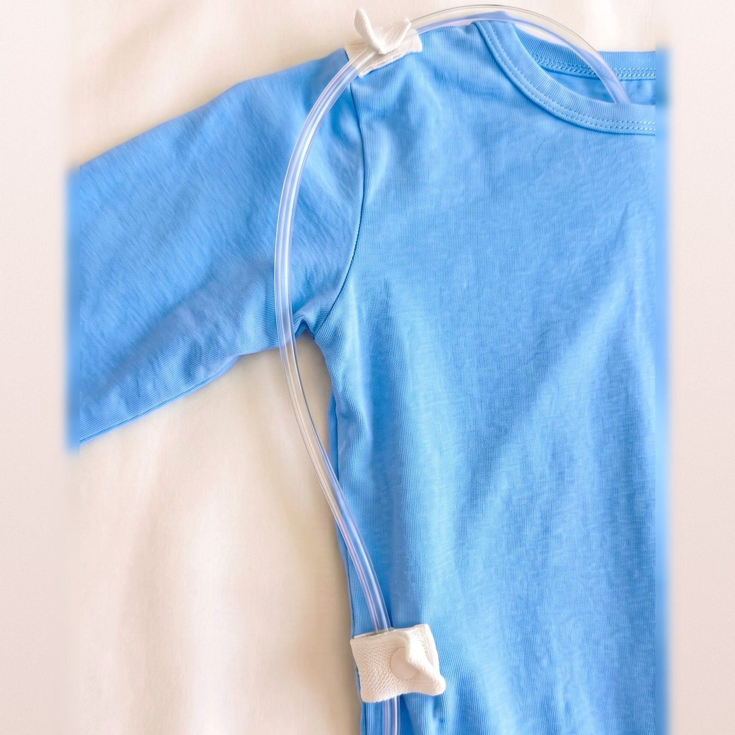 Line threaded through the shoulder and lower-back RoutePoints on a Sky Lullaby adaptive garment