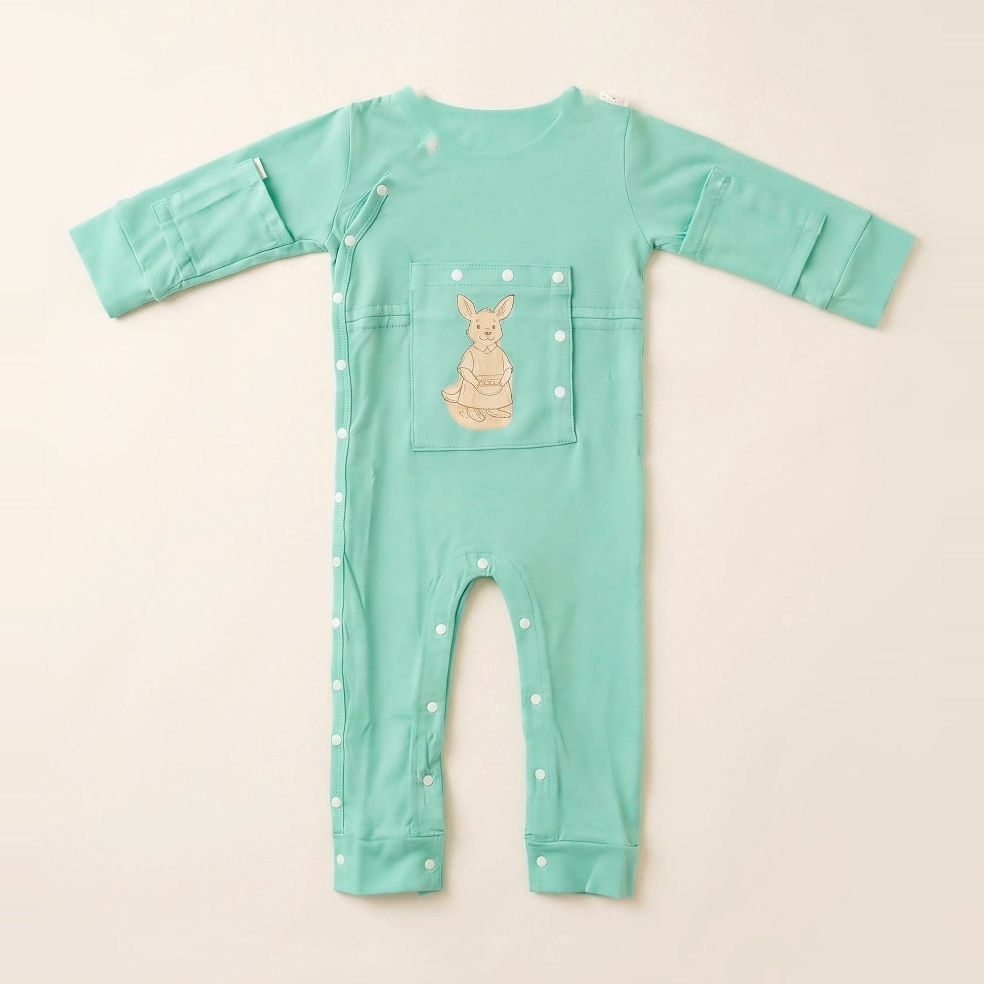 LineWear Chest Edition adaptive central line bodysuit in Calm Mint, laid flat with the PediaPouch chest pocket closed