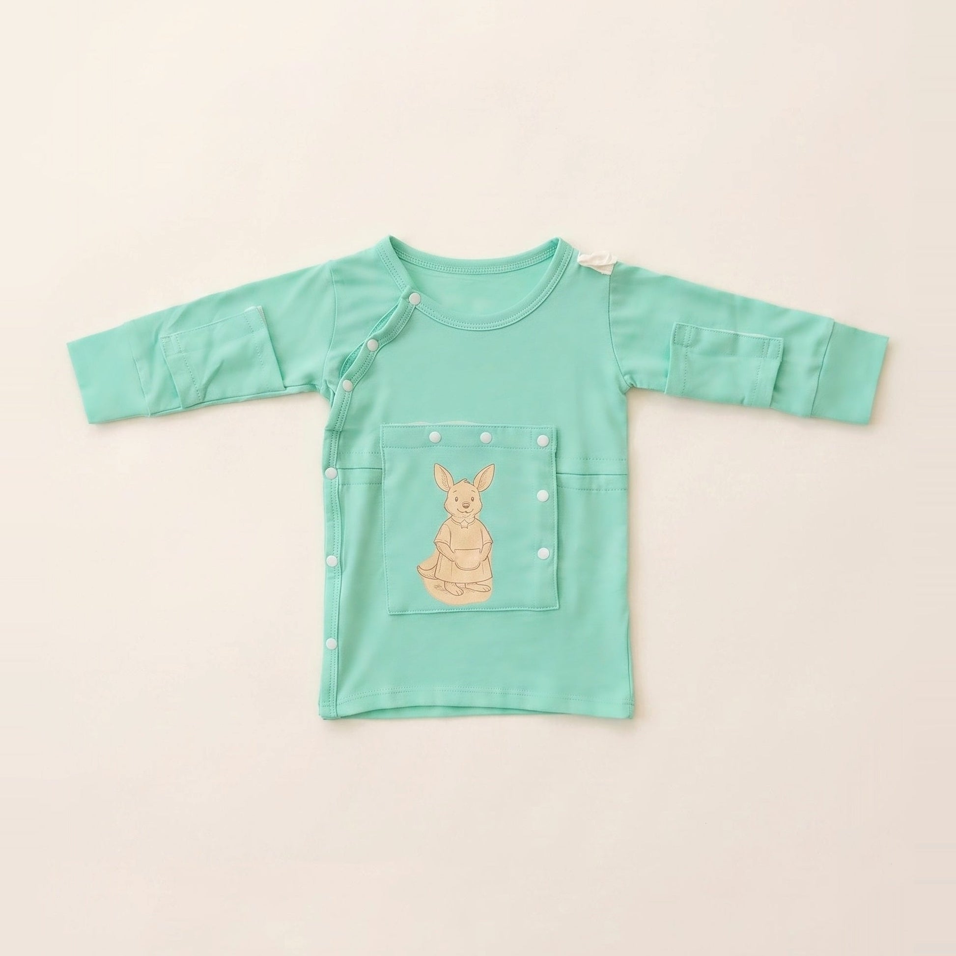 LineWear Chest Edition adaptive central line gown for newborns in Calm Mint, laid flat with the PediaPouch chest pocket closed