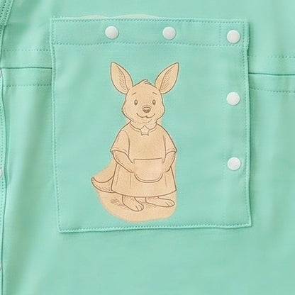 Close-up of the centred PediaPouch snap-close chest pocket with kangaroo detail on the LineWear infant gown