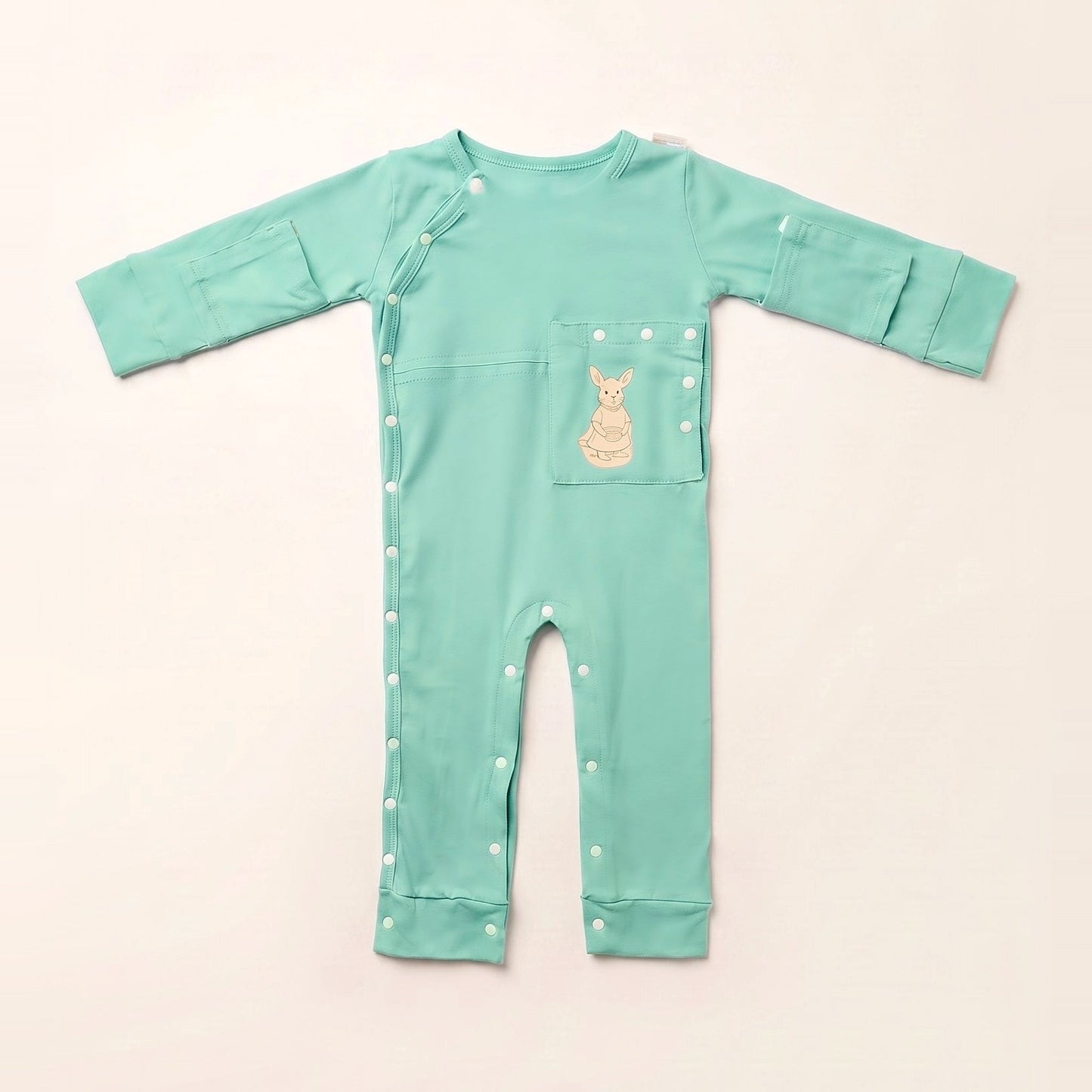 TubeWear adaptive G/J tube bodysuit in Calm Mint, laid flat with the PediaPouch tube pocket closed