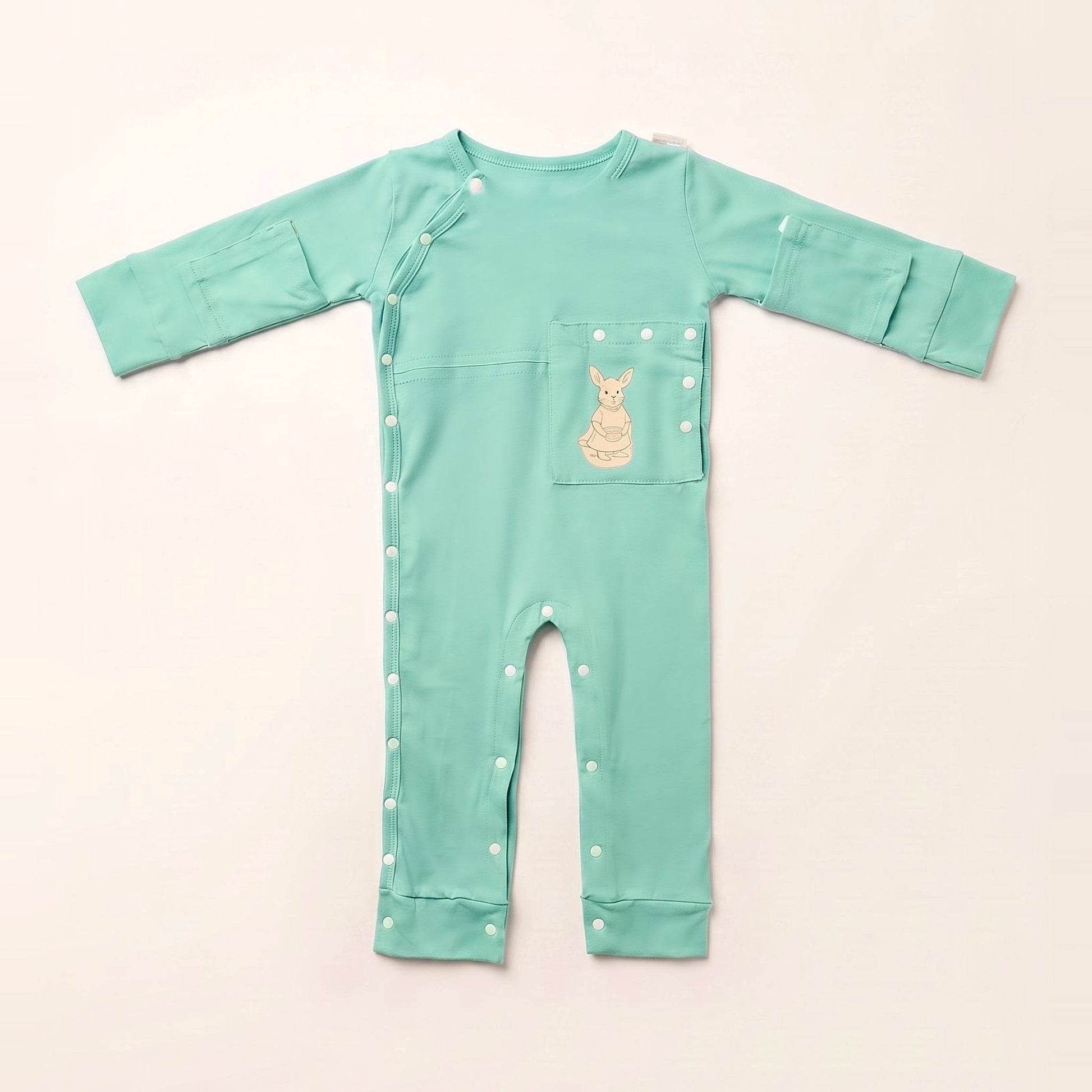 TubeWear adaptive G/J tube bodysuit in Calm Mint, laid flat with the PediaPouch tube pocket closed
