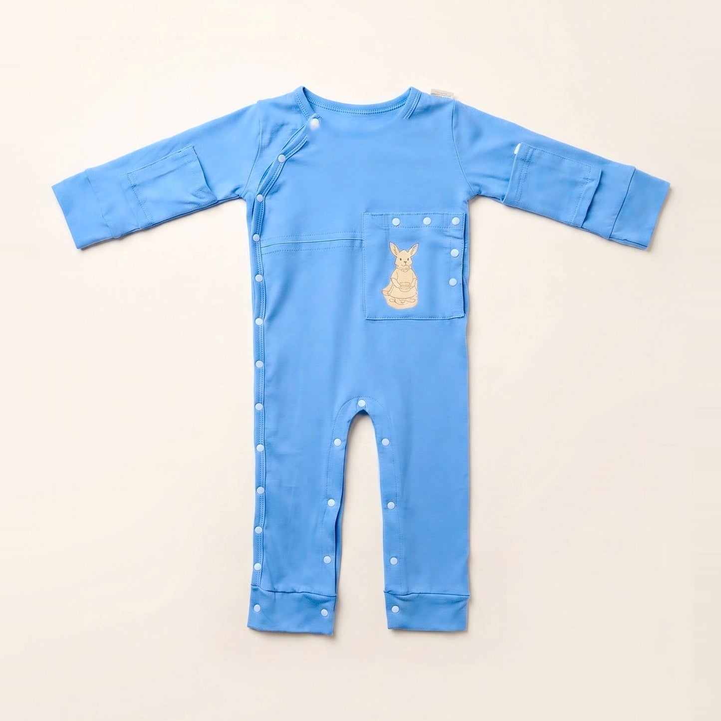 TubeWear adaptive G/J tube bodysuit in Sky Lullaby blue, laid flat with the PediaPouch tube pocket closed