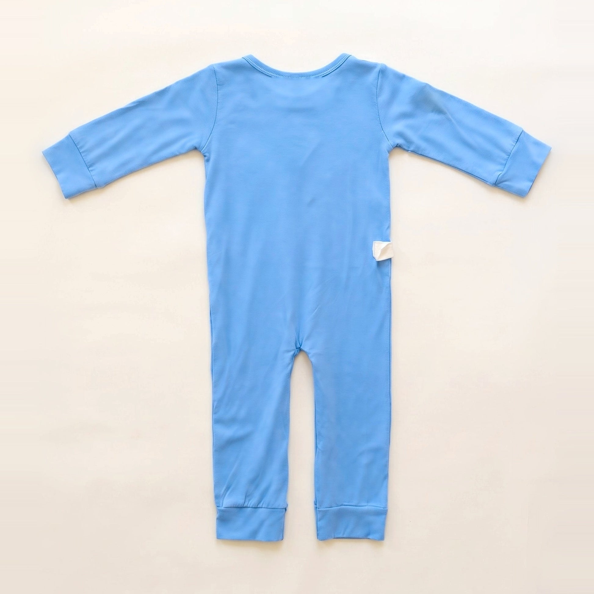 Back of the Sky Lullaby adaptive bodysuit showing shoulder and lower-back RoutePoints line guides