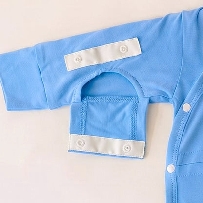 Dual Arm Access sleeve opening snapped open on the Sky Lullaby adaptive infant gown